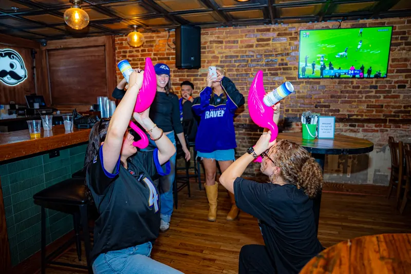 A packed bar at Liv's Tavern celebrating a Ravens win